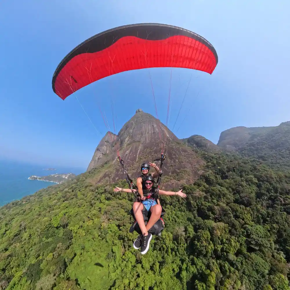 A red canopy against the green face of the mountain